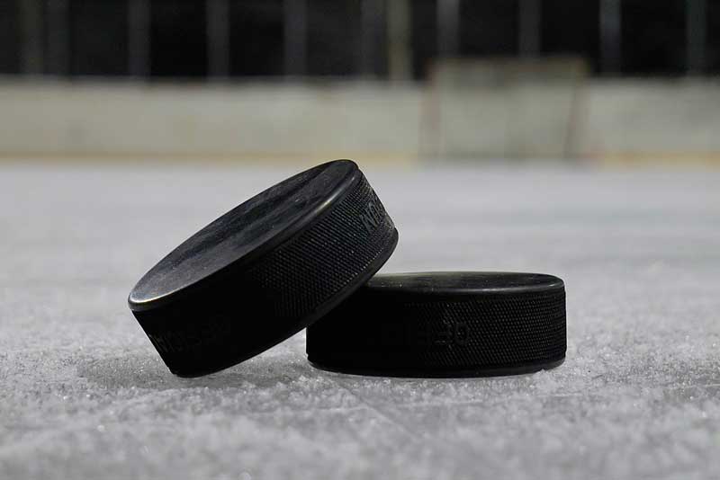Three Hockey Pucks size by size make 9 inches