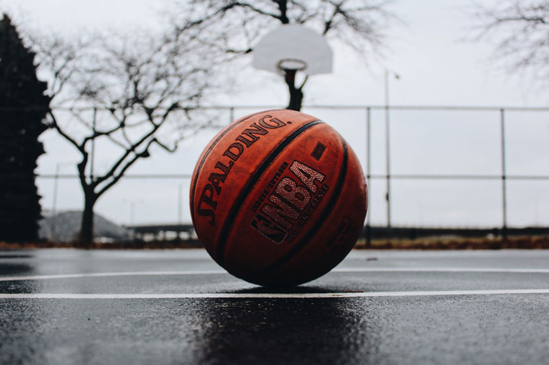 The weight of the basketball is 0.620 kilograms